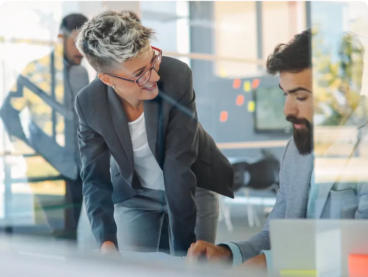 a lego man riding a motorcycle next to a toy car