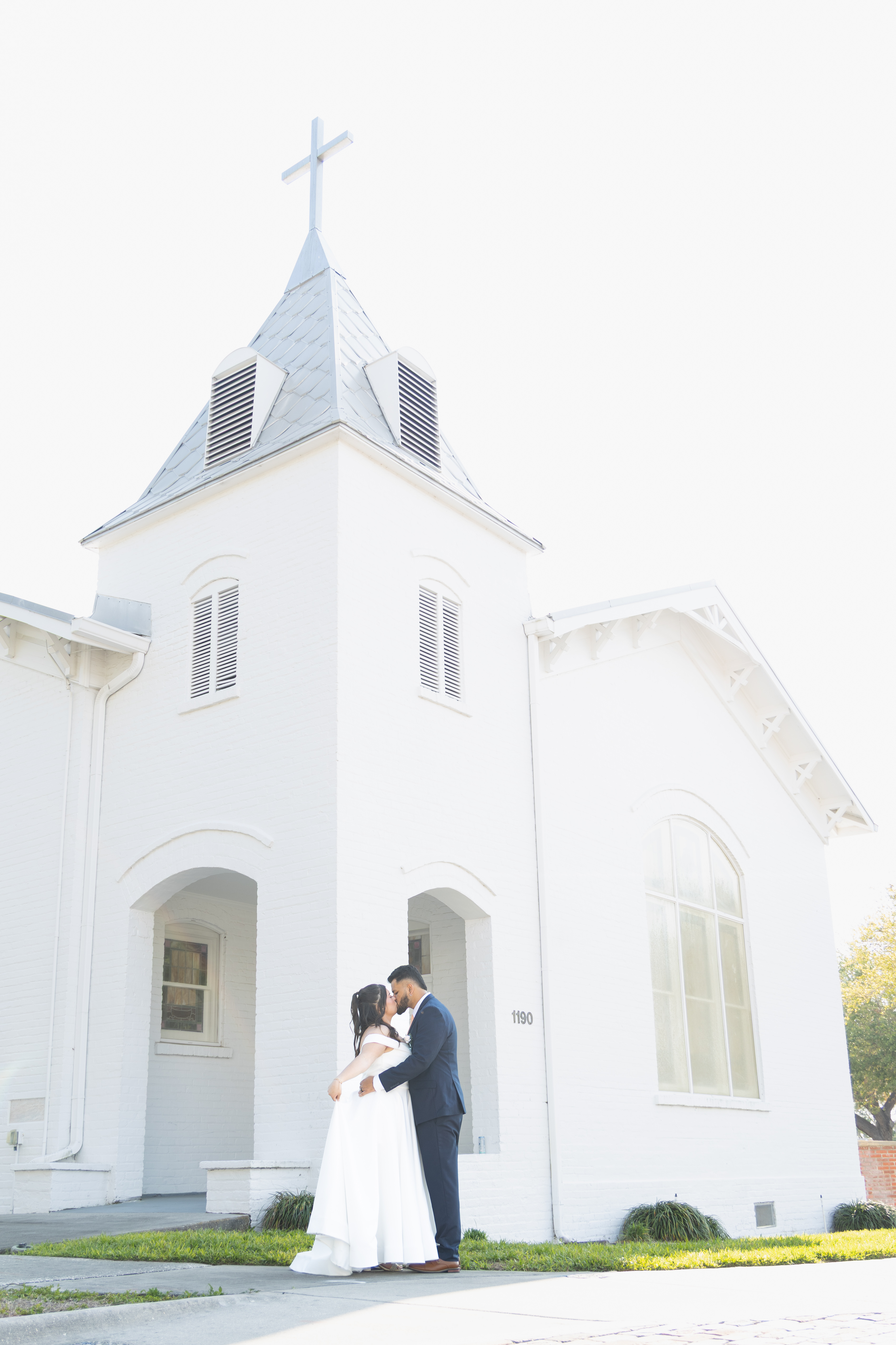 Couple embracing in natural light engagement session by Perfect Angle