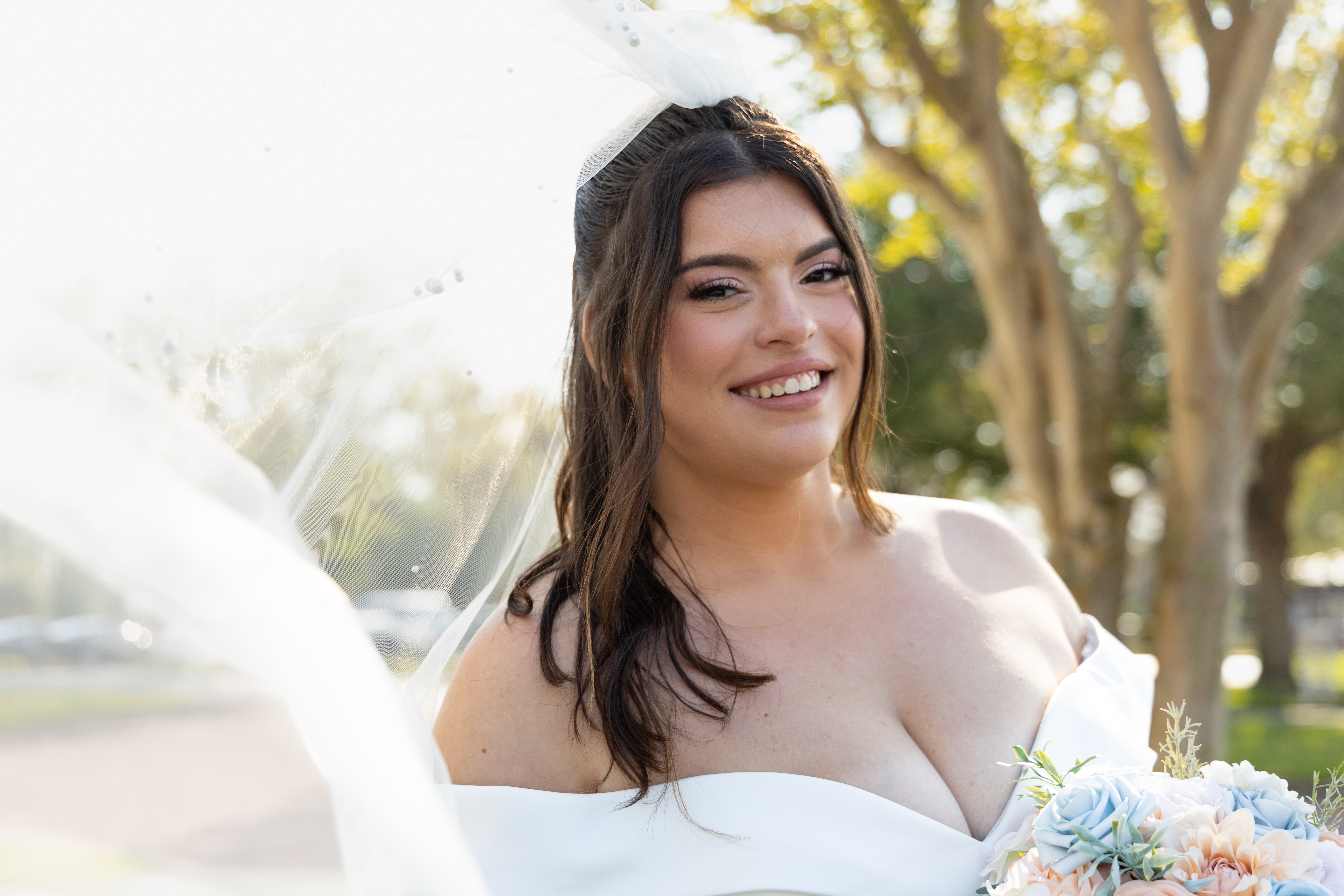 Couple hugging after surprise proposal during Tampa waterfront photoshoot