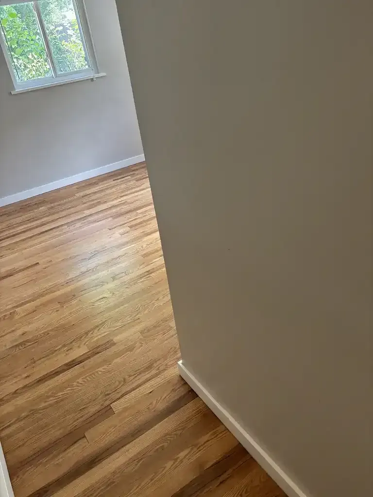 Castle Pines LVT abrasive soil — red clay iron oxide and pine forest grit removed by pre-vacuuming before wet cleaning