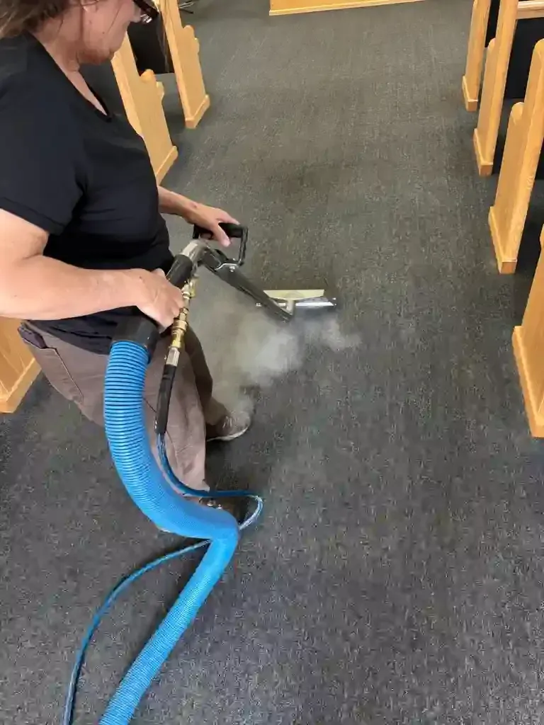 Castle Pines commercial entry carpet dual soil contamination — red clay iron oxide and pine forest organic material at commercial foot traffic volume