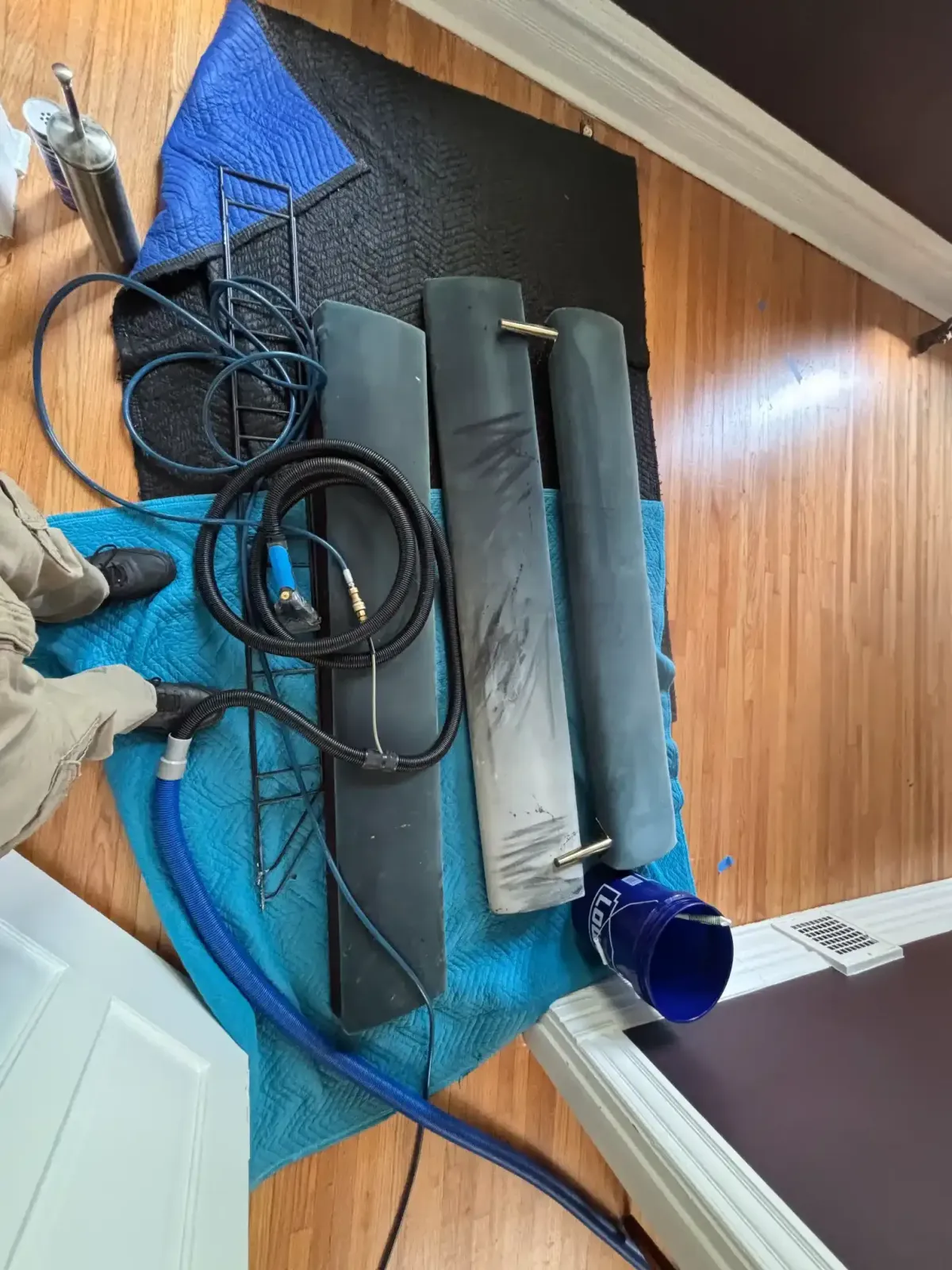 Portable carpet extractor set up in a third-floor RiNo Denver apartment with no truck access