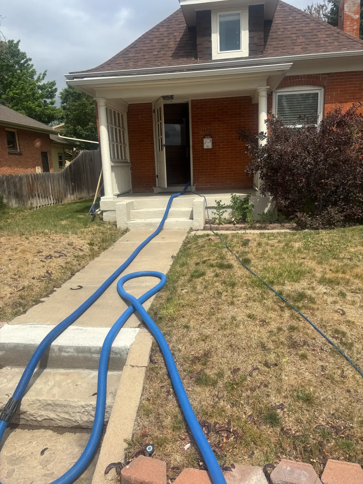 exterior of 1960s Englewood ranch-style home or neighborhood street
