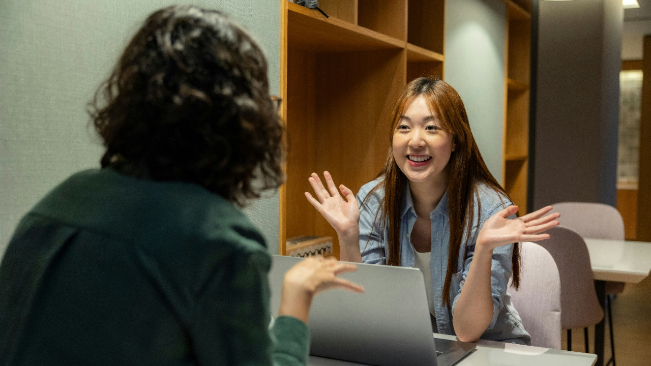 Manager engaging an employee by asking questions to encourage buy-in and participation