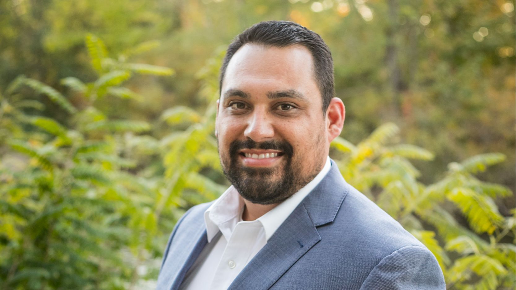 Small business owner reviewing recruiting strategies to attract high-quality candidates