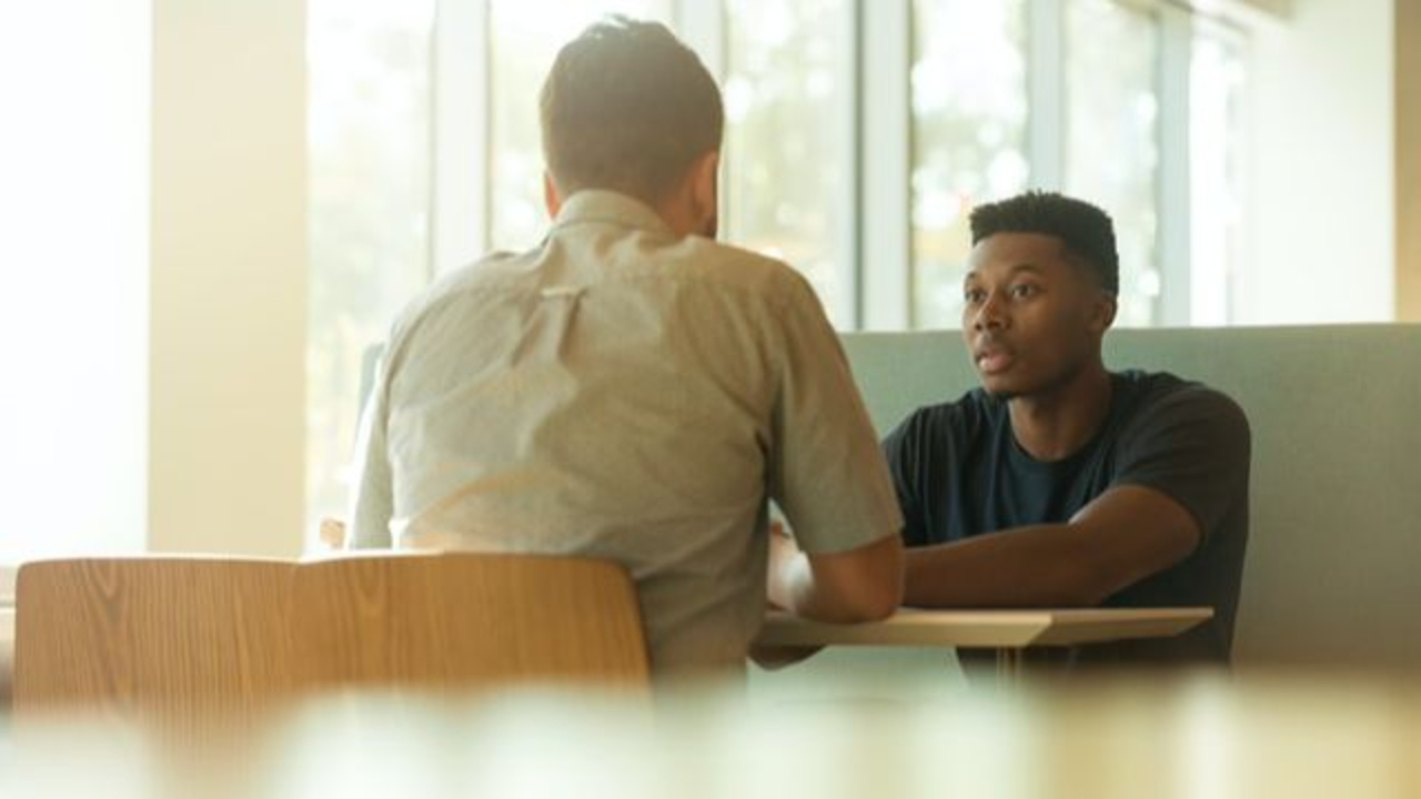 Manager coaching an employee and providing constructive performance feedback
