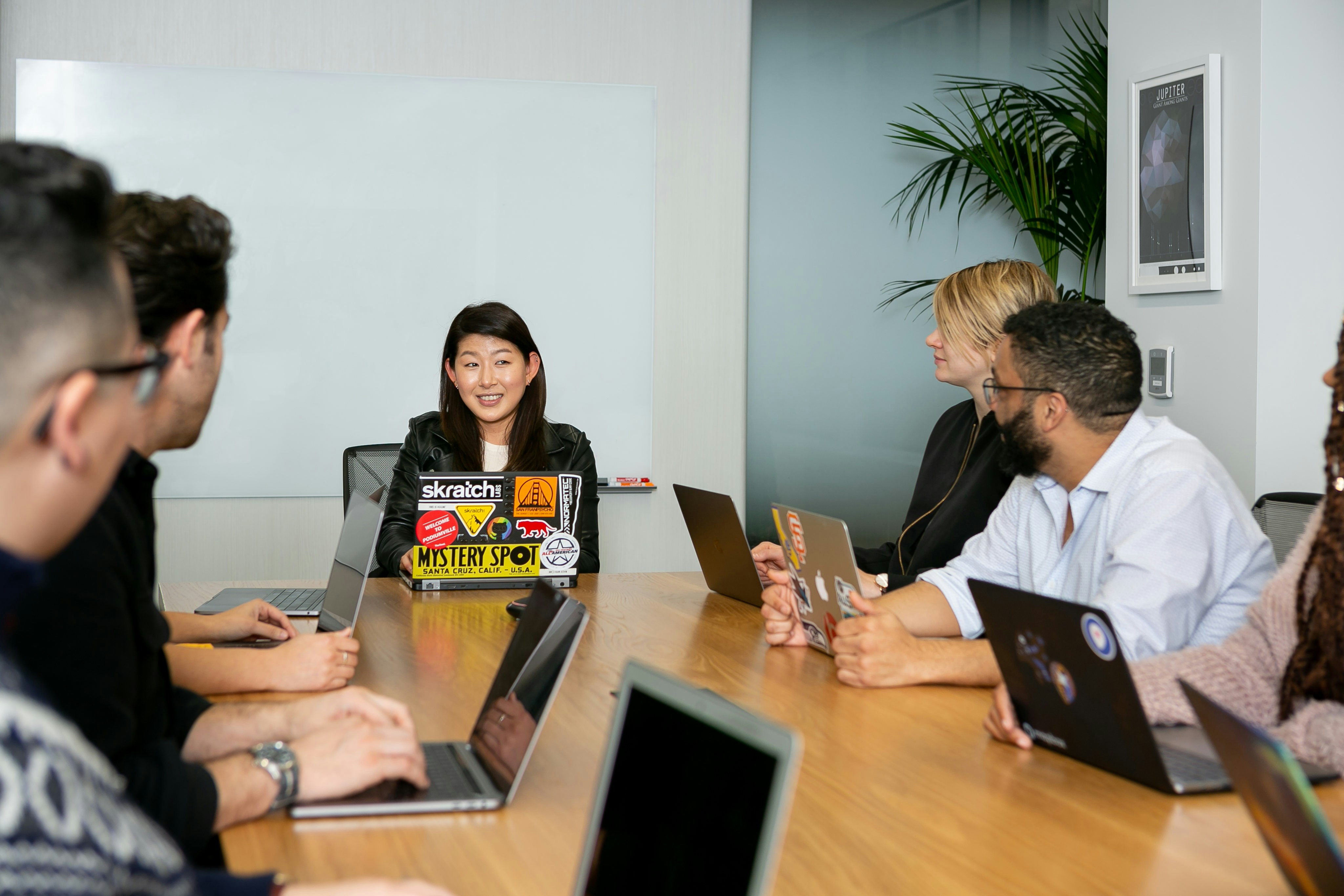 manager leading a meeting at a table