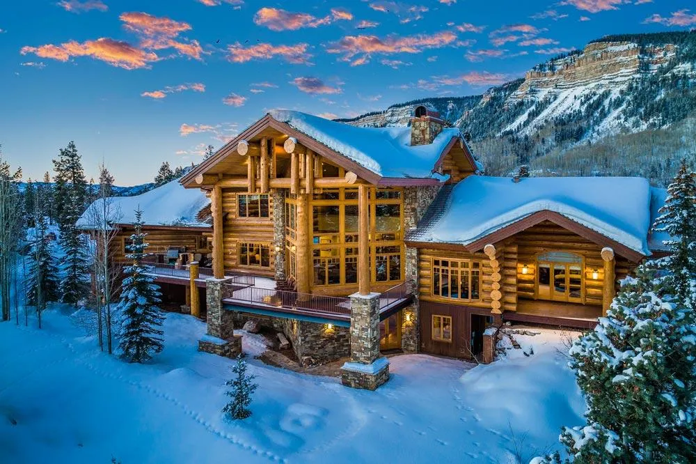 Log cabin home in the mountains during the winter
