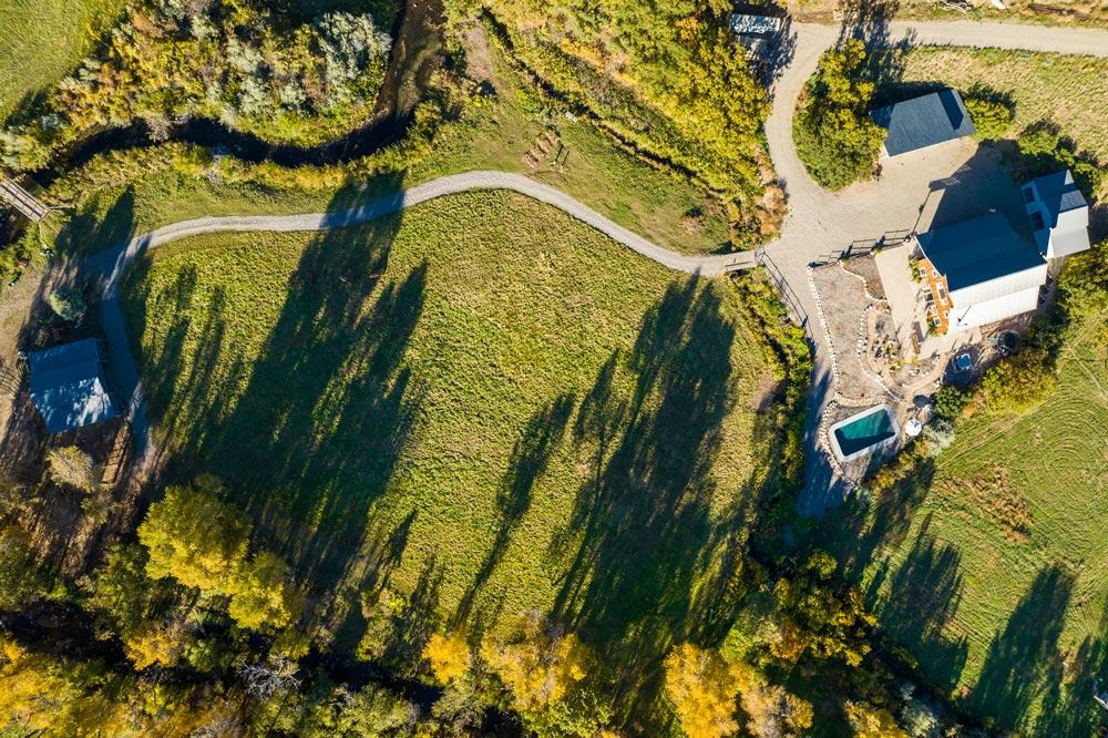 Drone photo looking straight down on a horse property in the fall
