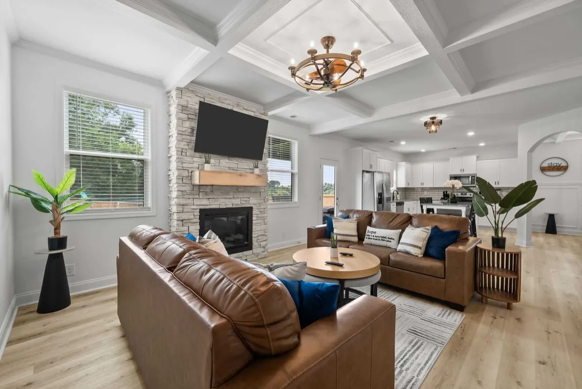MPower Restoration turnkey family living room with warm residential lighting and fully equipped comfort