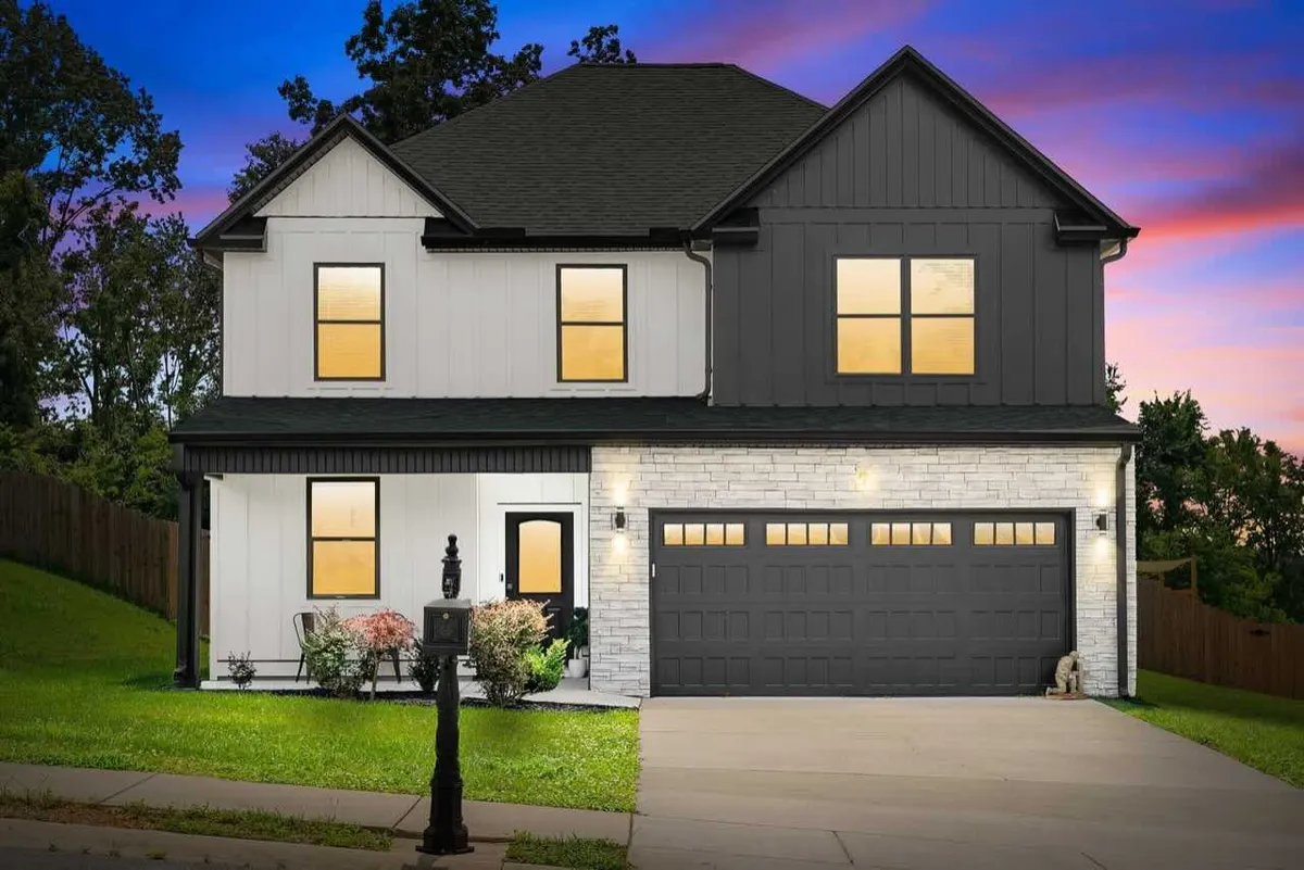 Highland Haven executive extended-stay home with oversized driveway and manicured lawn