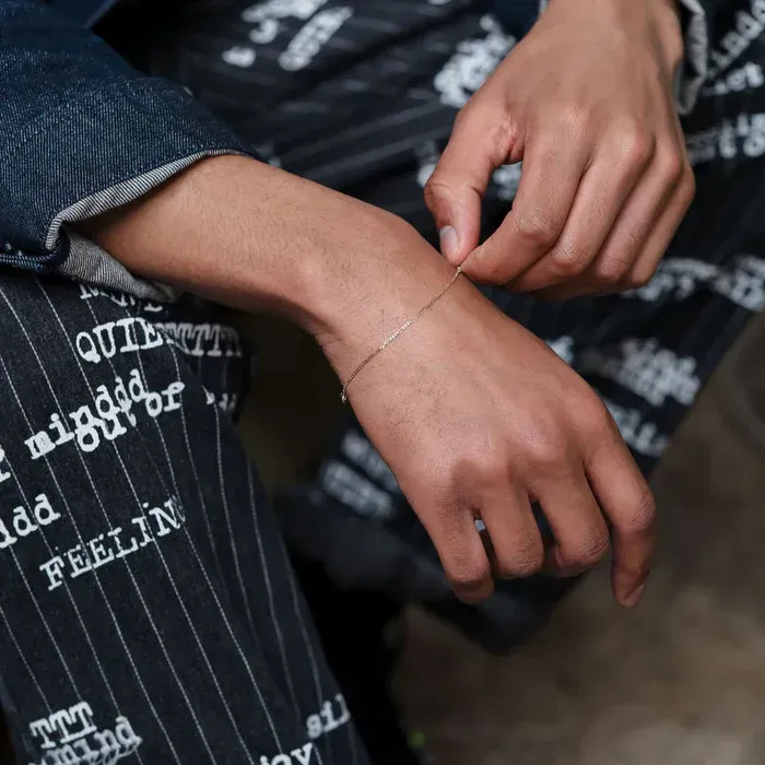 a woman laying on the ground with her legs crossed