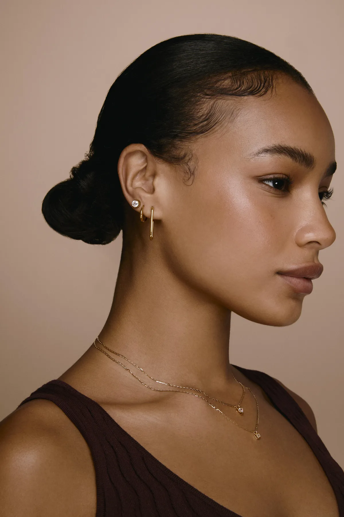 Woman with cigarette under red and blue lights.