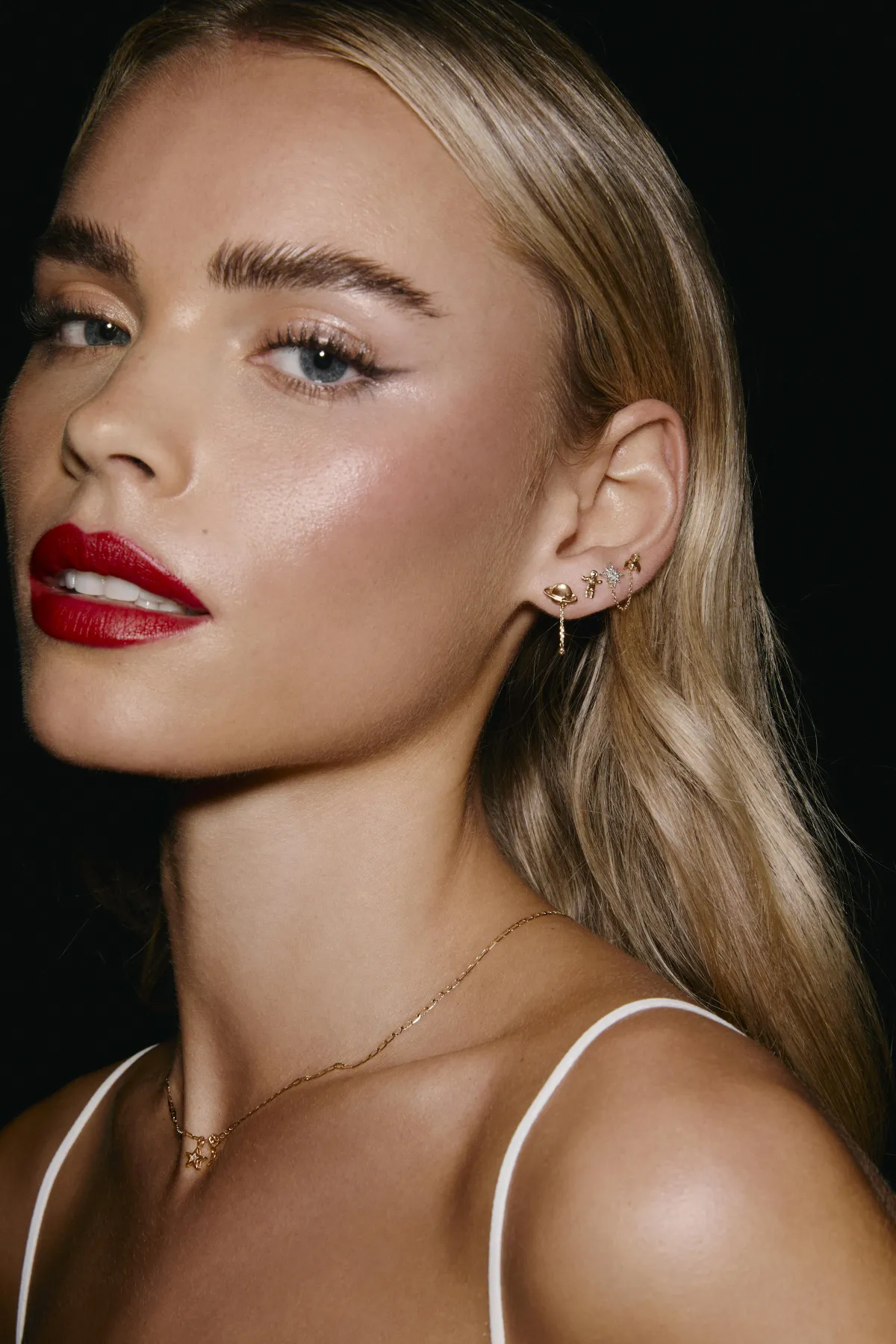 a barber shop with chairs and pictures on the wall