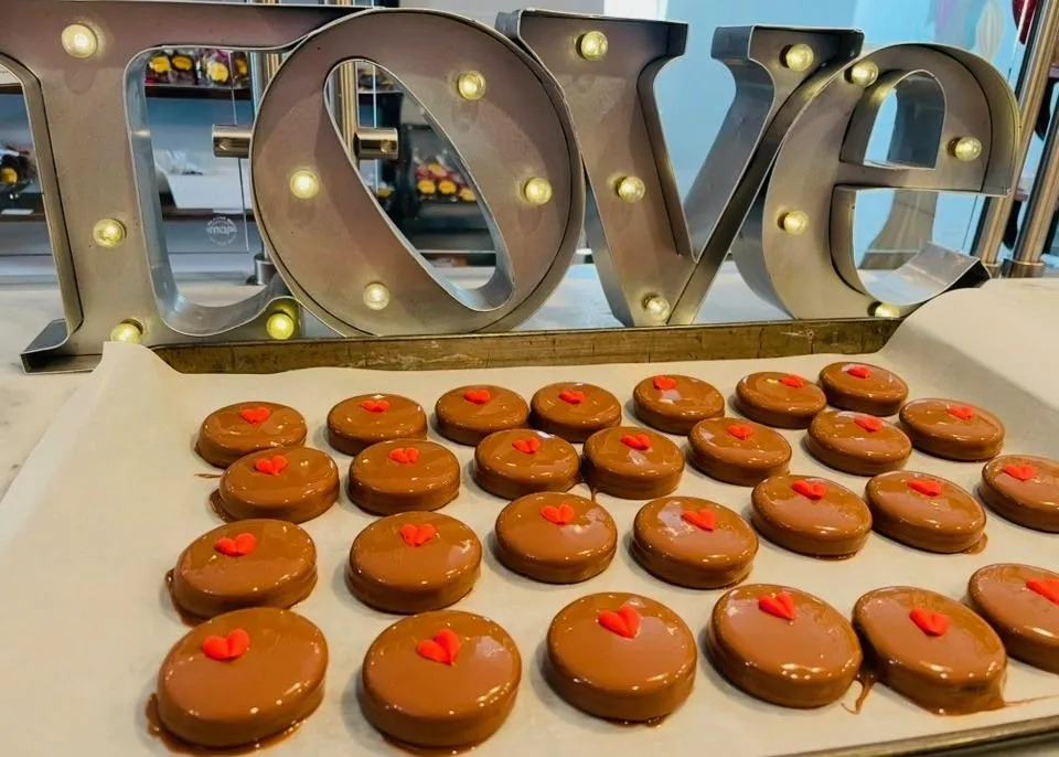 a box of assorted chocolates sitting on a table