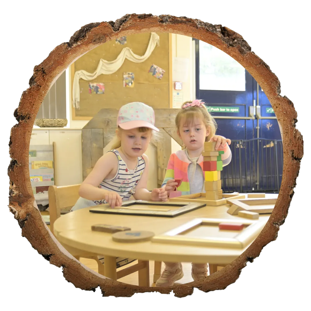 children stacking blocks at a table