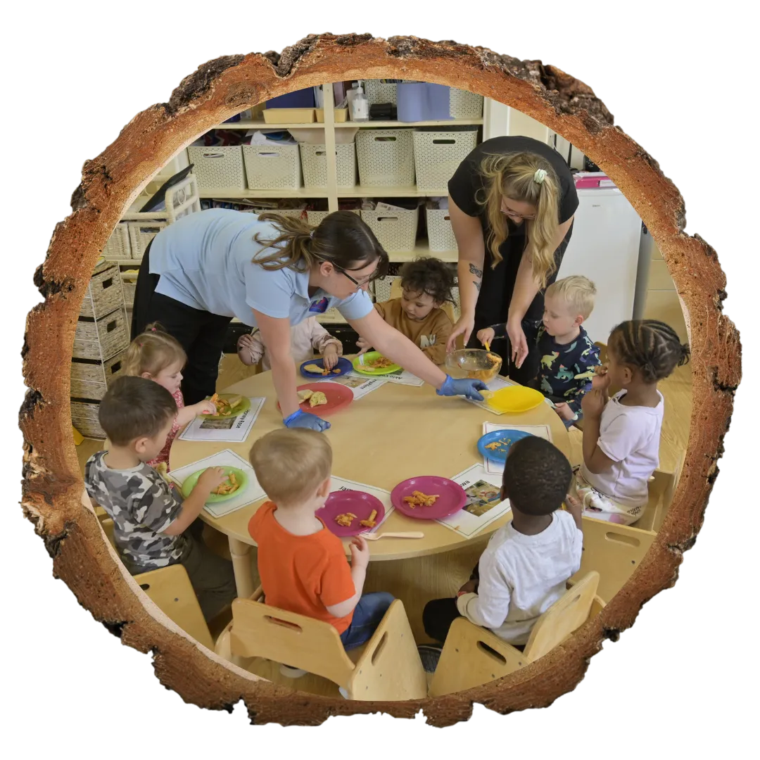 children sat around table painting