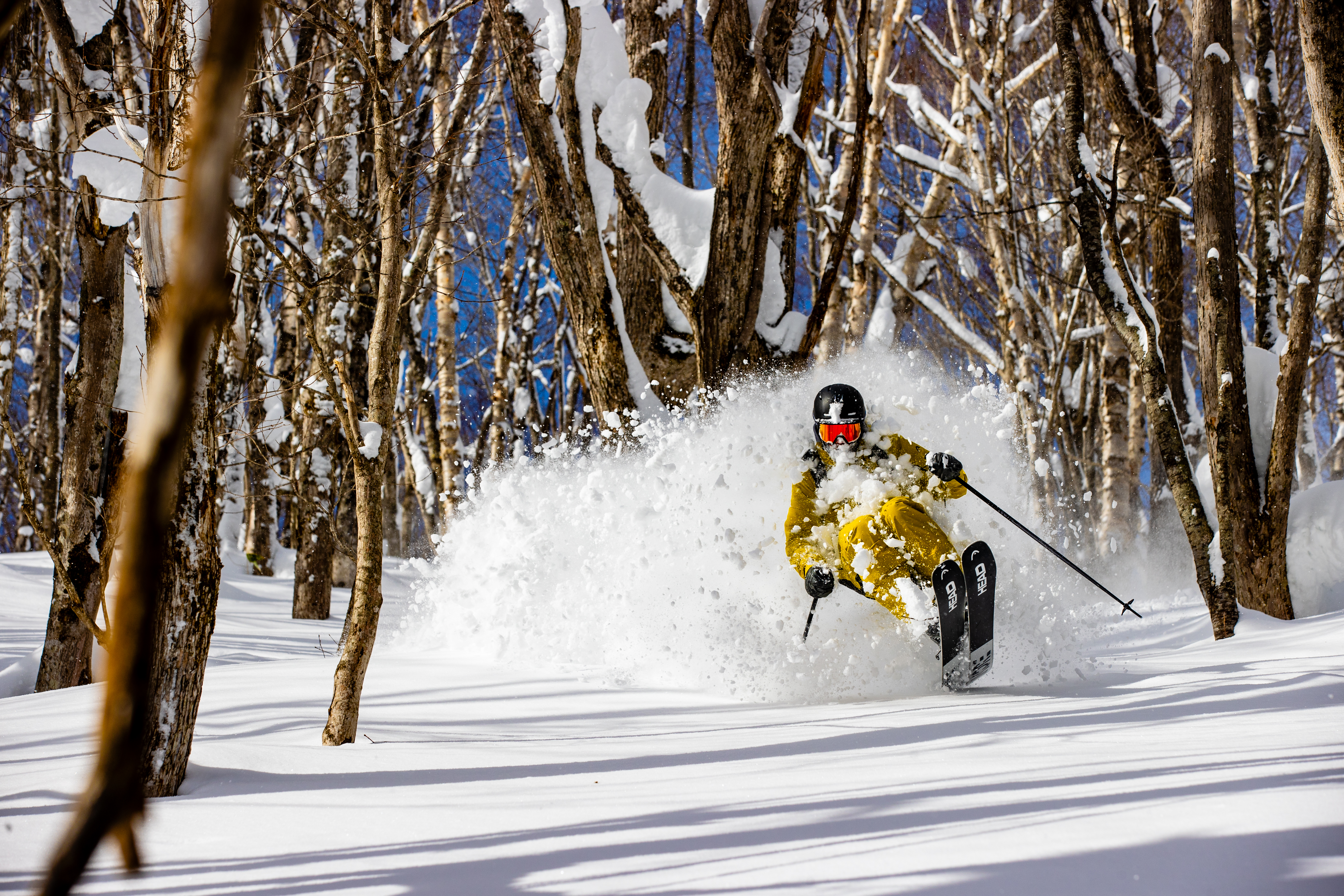grayscale photo of mountains near body of water