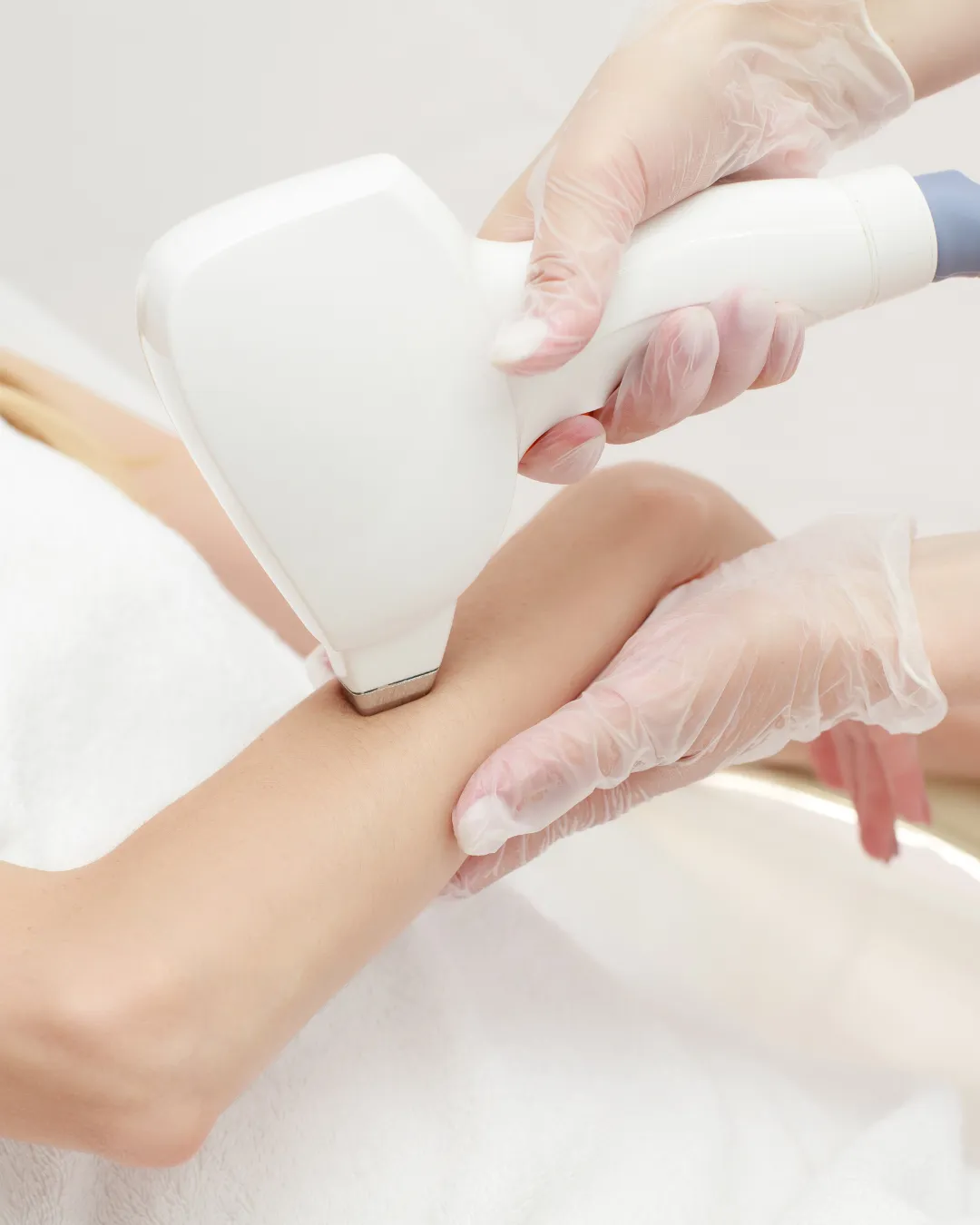woman in white tank top holding white labeled bottle