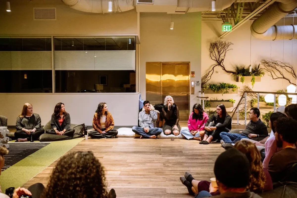 Event participants engaging in relational healing with Danielle Aubrey Smith