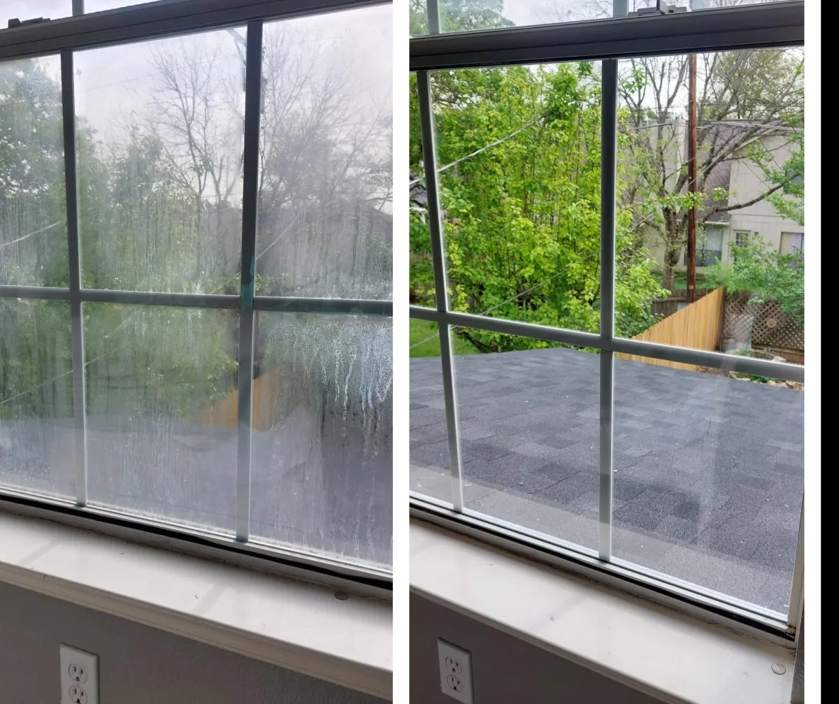 A messy window replacement project showing torn drywall and framing debris
