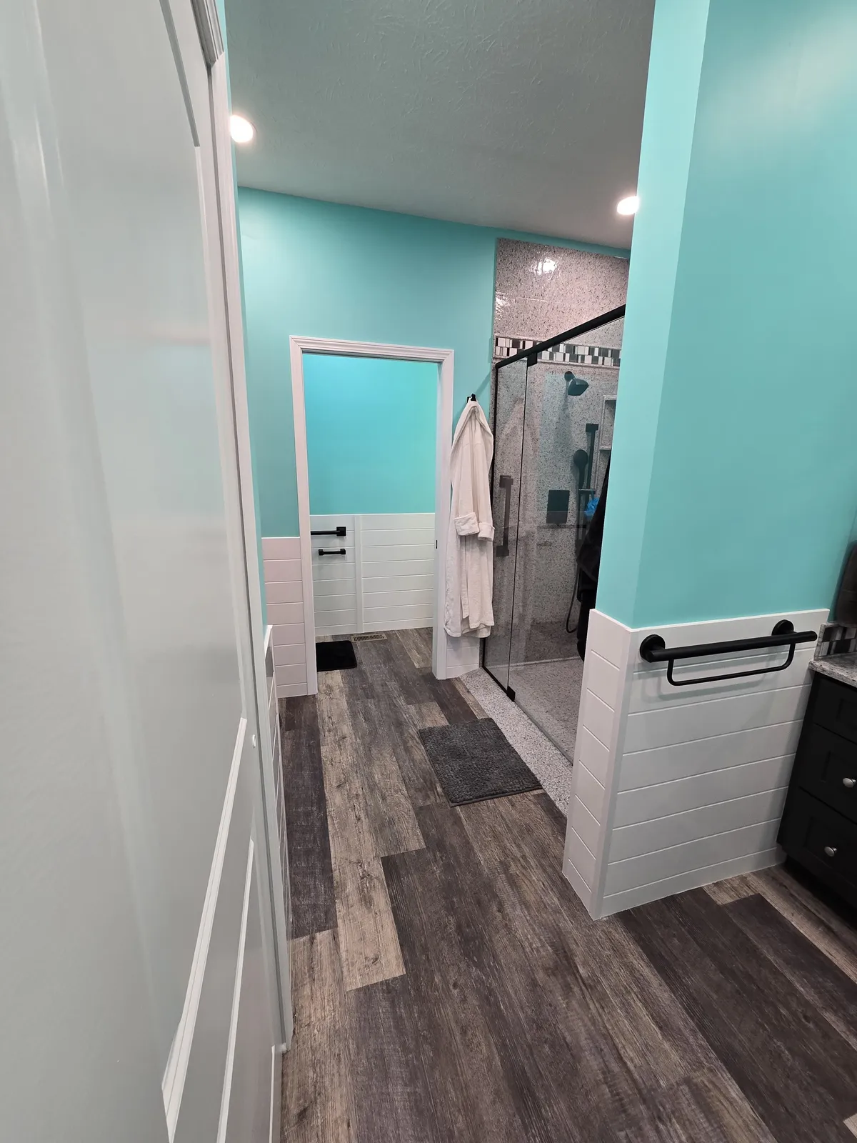 Remodeled bathroom with a walk-in shower and vanity