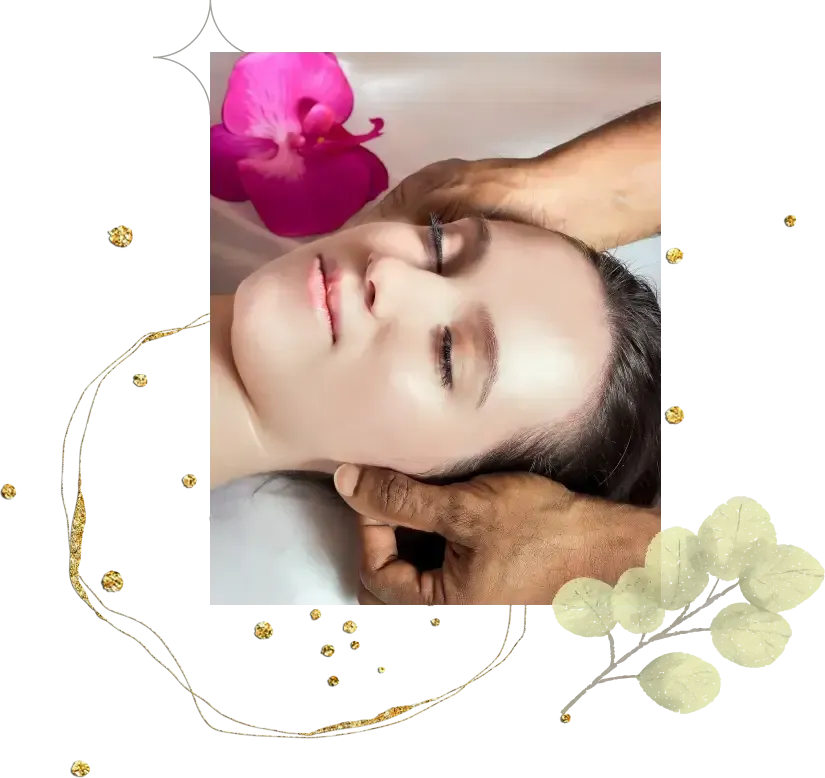 A person is enjoying a soothing facial massage while lying down with their eyes closed, a pink flower delicately placed near their head.