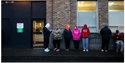 People waiting in line outside a methadone clinic — MEDIVIRA offers private discreet office-based Suboxone treatment and telehealth in Frisco TX with no waiting lines no stigma and same-day appointments