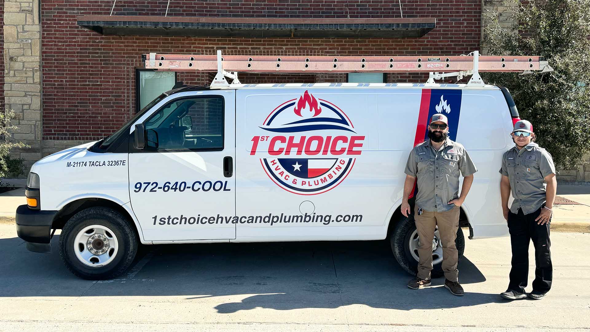 Technician standing proudly next to a 1st Choice branded van