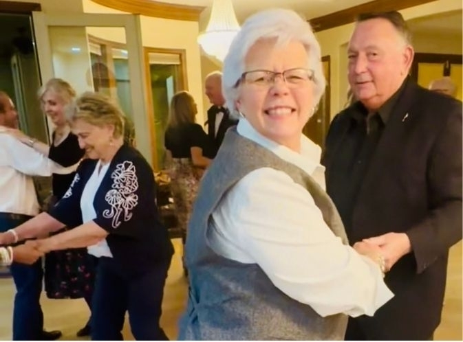 Jane Jensen Saint, enjoying some swing dancing with her husband, James