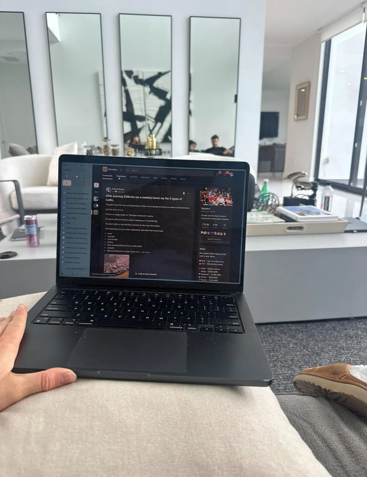 woman in white long sleeve shirt using black laptop computer