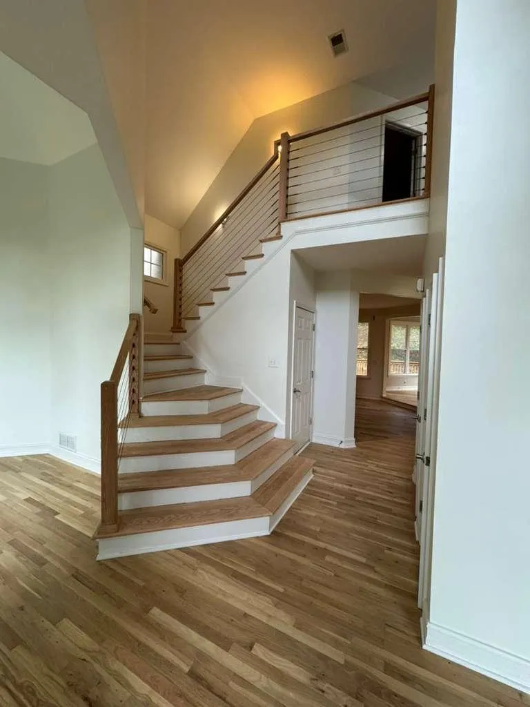 a pile of wood behind a metal fence