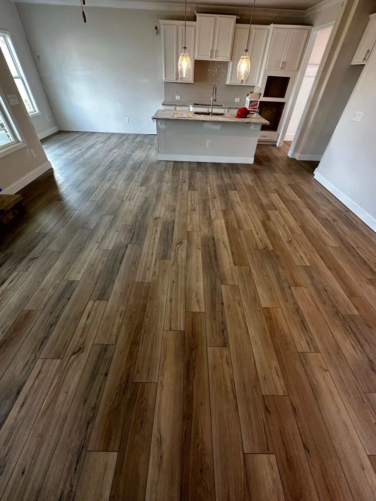 a pile of wood behind a metal fence