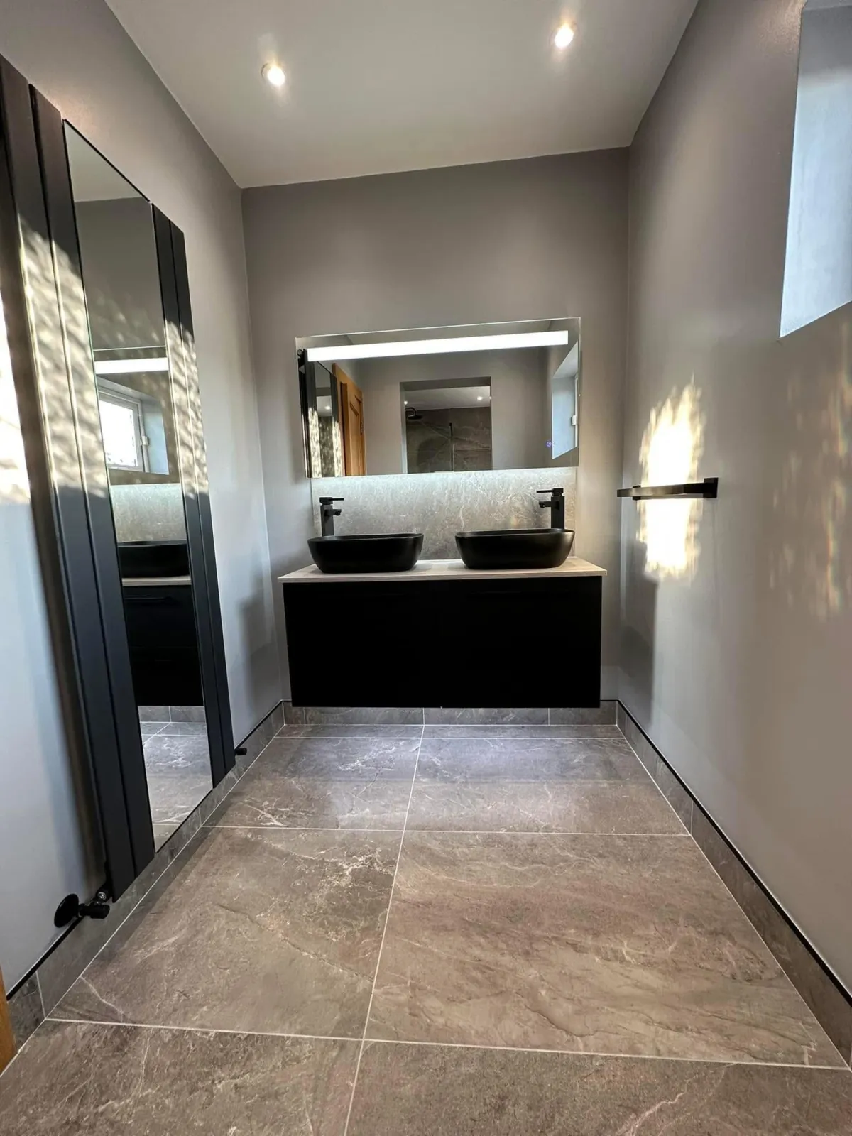white ceramic sink with stainless steel faucet