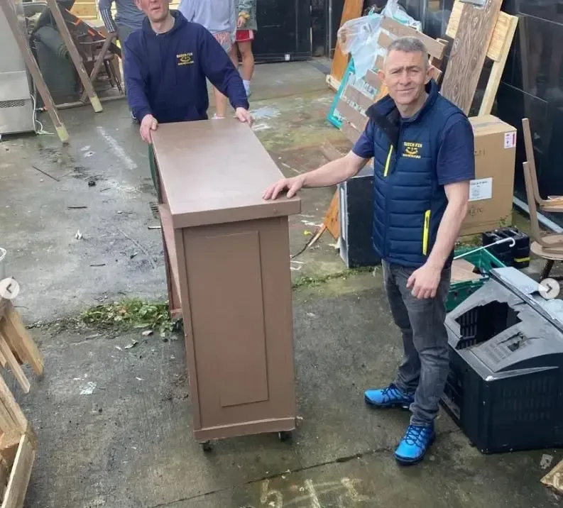 Garrett from Quick Fix Removals with furniture piece ready for delivery Dublin
