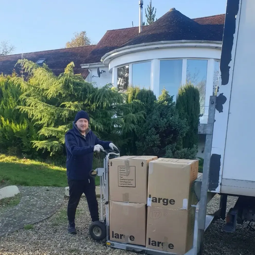 Quick Fix Removals man with a van Dublin delivering boxes to new home