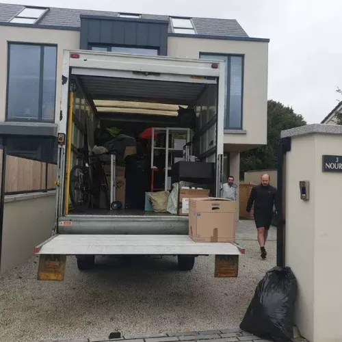 Quick Fix Removals team carefully moving household furniture into a Dublin home