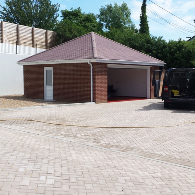 Garage conversions in Caversham with the door opening bricked up and a new window fitted