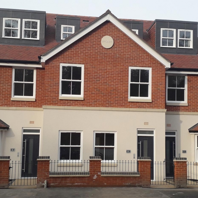 New home construction in Caversham with scaffolding around a house at first fix stage