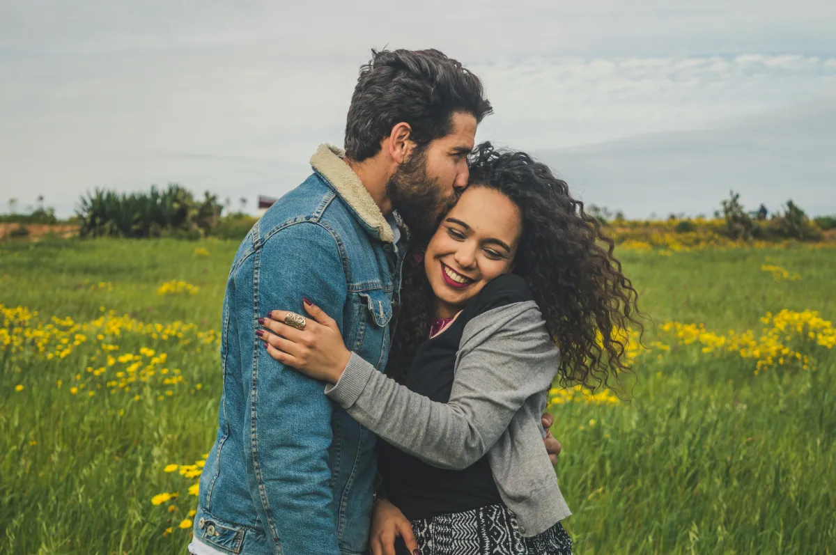 Couple holding hands and smiling