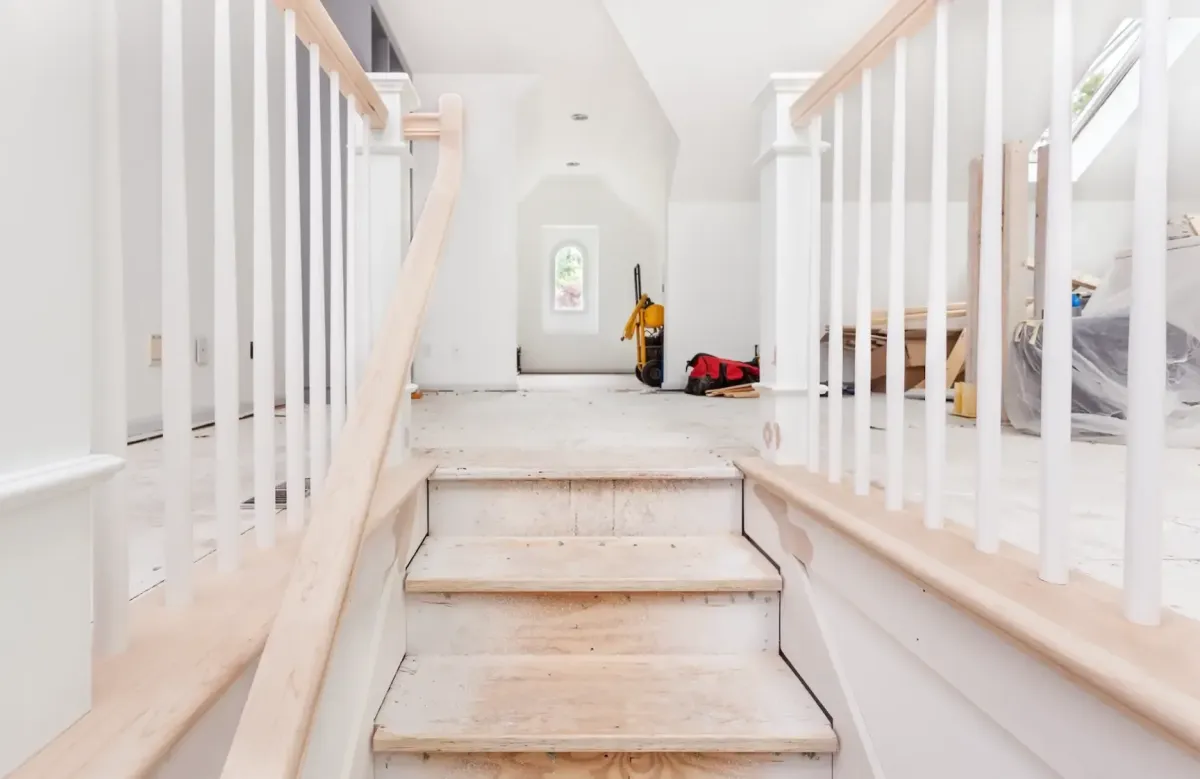 a messy hall way needing post construction clean up in a home