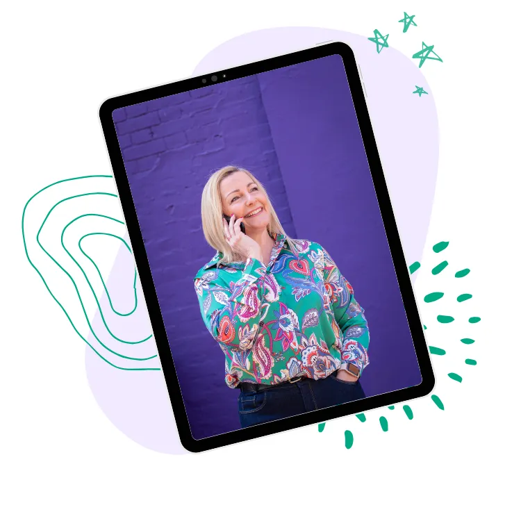 A tablet screen showing a picture of Justine on the phone in  front of a purple wall