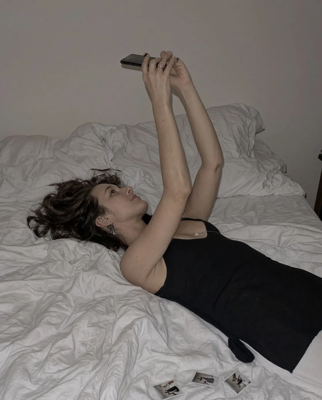 Harshly lit, uncurated smartphone portrait demonstrating low production value