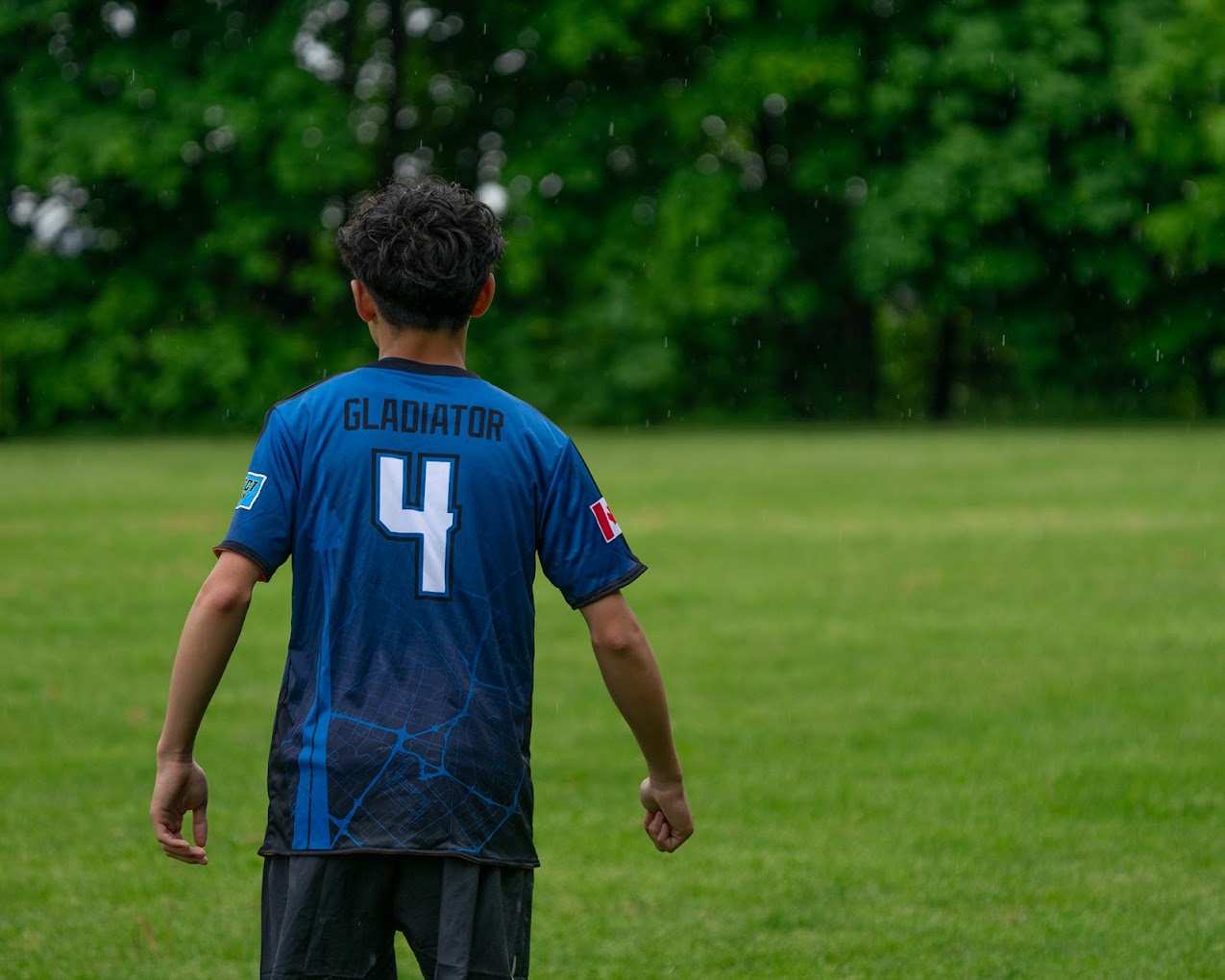 Soccer coach high‑fiving a young player