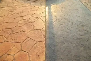 Stamped concrete patio slab with decorative finish and color contrast in Kansas City backyard