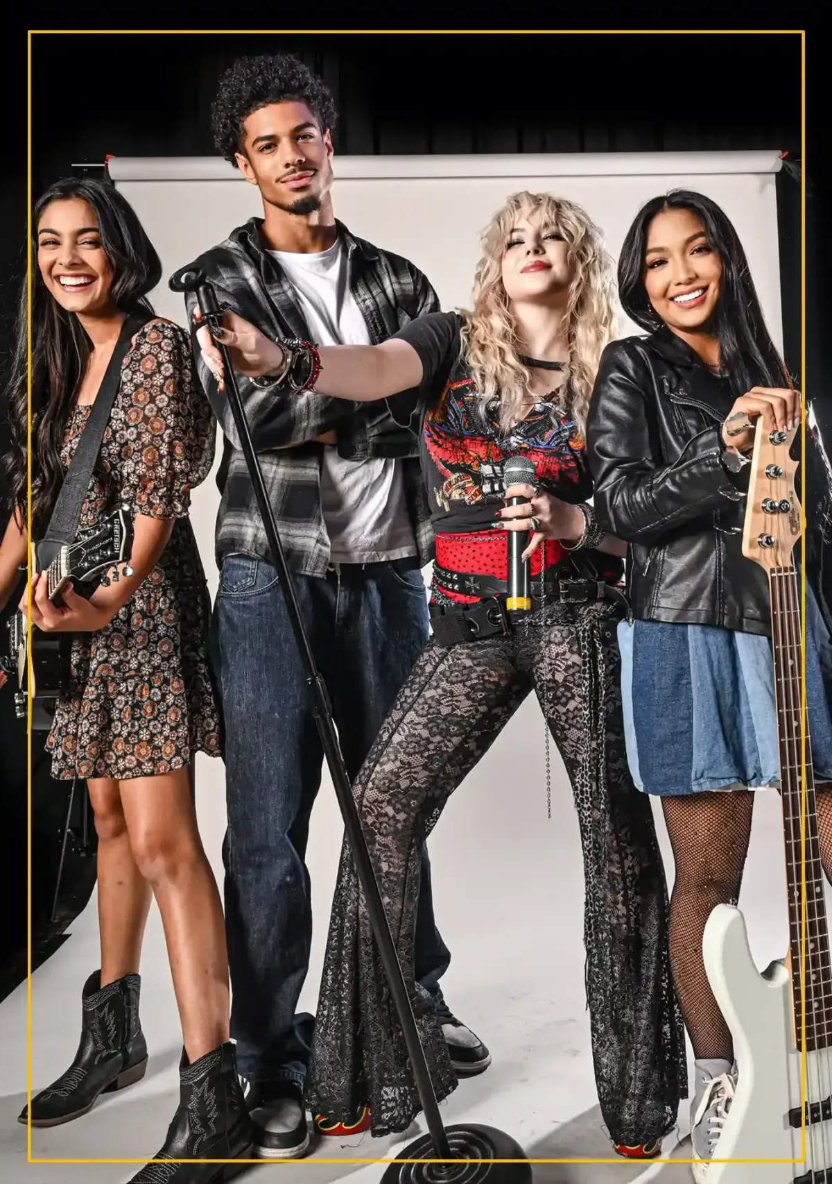 Group of teens playing guitar, bass, and singing during a Rockstars of Tomorrow band lesson program.