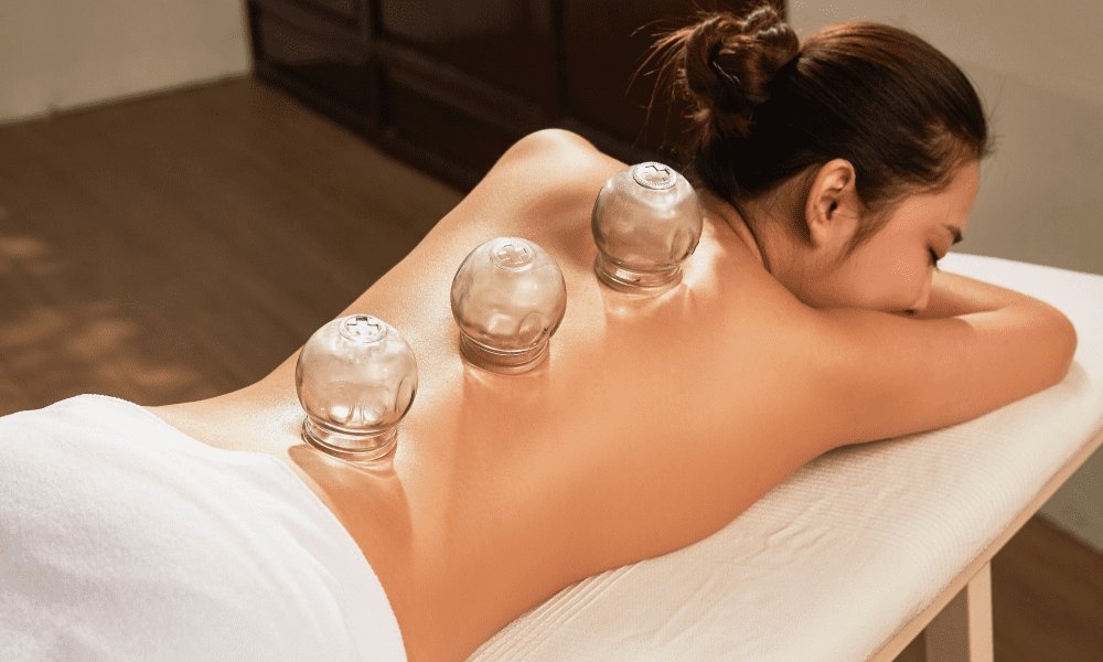 Cupping therapy massage add-on at Relax Massage Spa Bellevue WA — licensed therapist performing cupping treatment for back pain relief near me