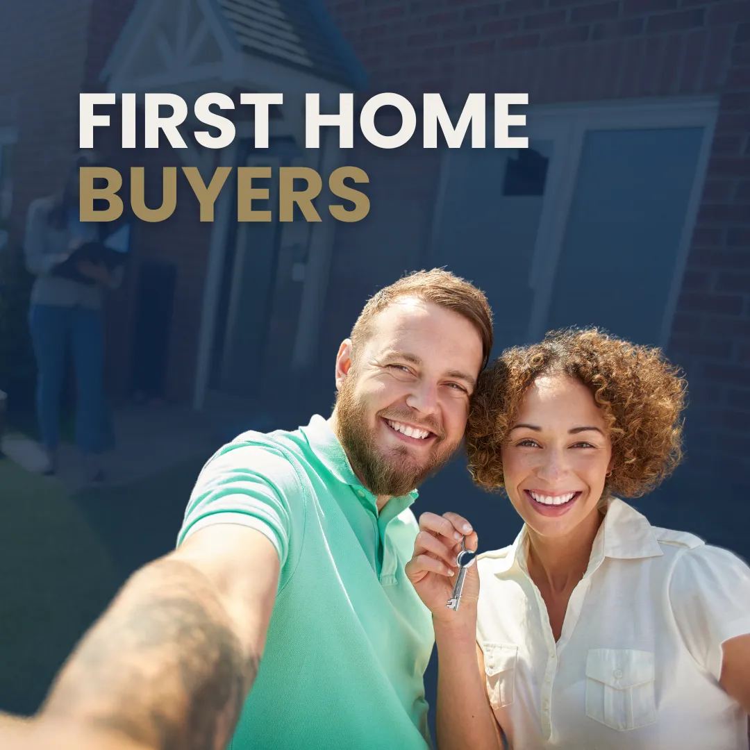Happy couple holding house keys in front of their new home, representing first home buyers.