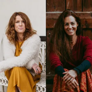 Portrait of Lorna MacPhail and Katherine Crawley sitting side-by-side, smiling, one with auburn hair and the other with dark hair.