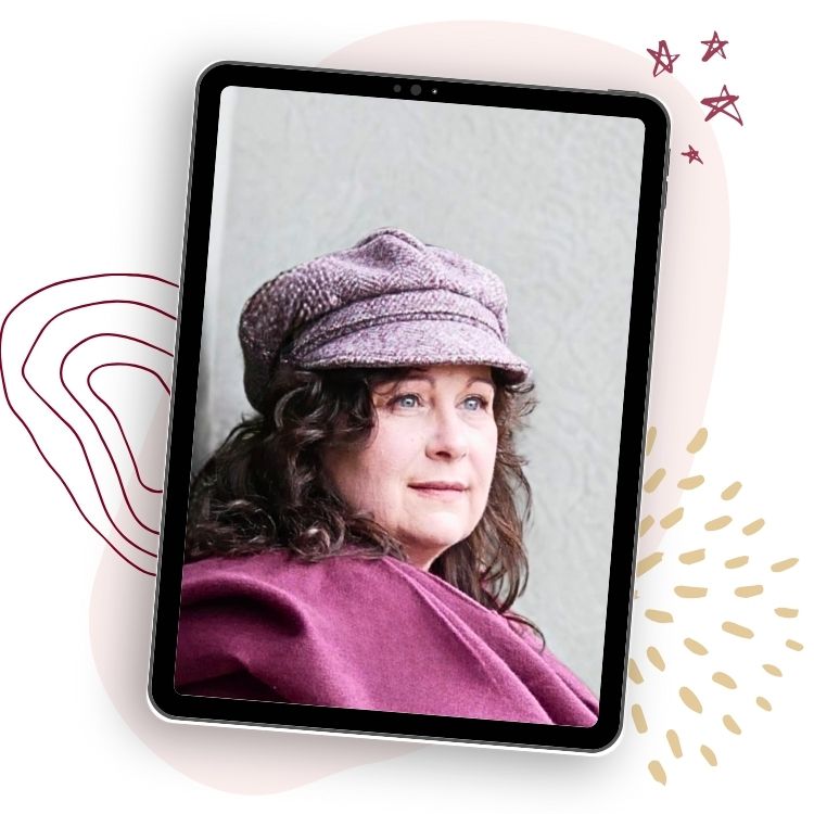 Image of Shirley wearing a burgundy scarf and pink flat cap